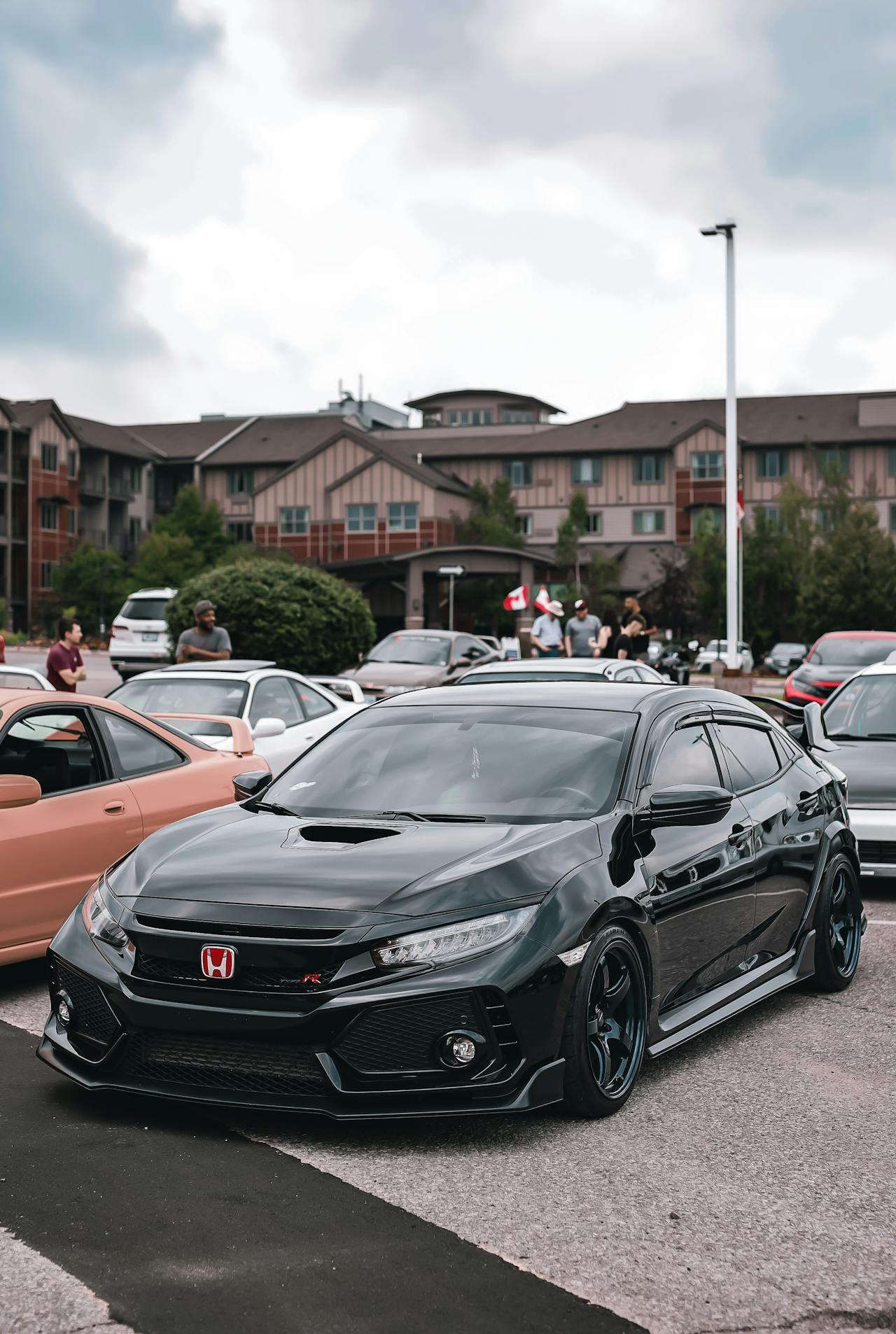 Modified black Honda Civic Type R at a performance car gathering