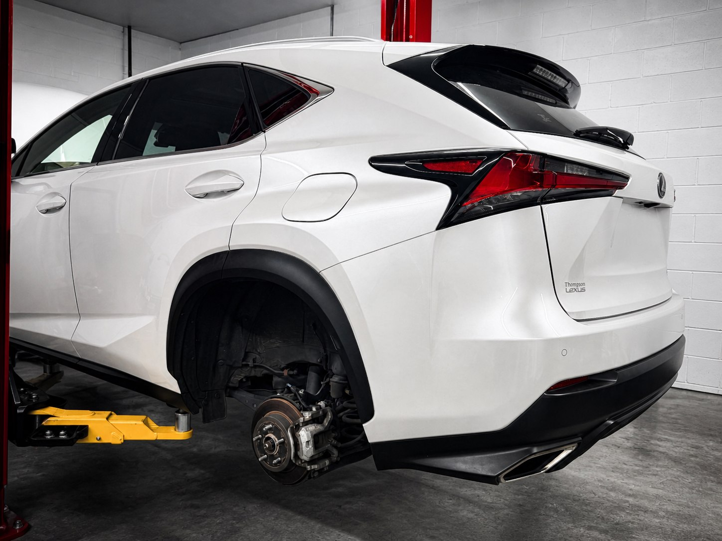 White Lexus receiving brake and suspension repair at Mr. Honditas in Toms River, NJ